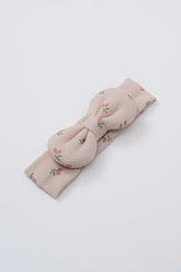 Avauma Lovely Bloom Headband in Peach Cream, featuring soft beige-pink ribbed cotton and scattered pink rose floral design